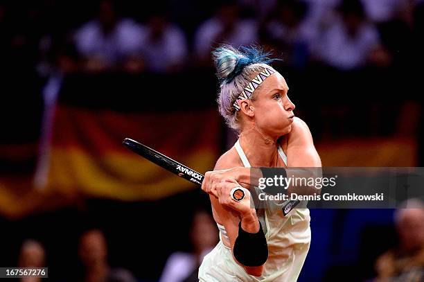 Bethanie Mattek-Sands of the United States plays a backhand in her match against Sabine Lisicki of Germany during Day 5 of the Porsche Tennis Grand...