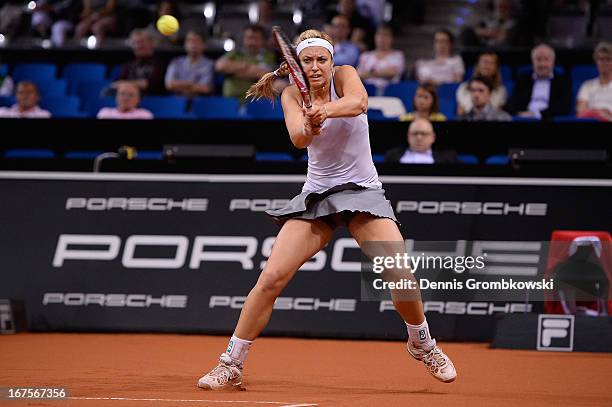 Sabine Lisicki of Germany plays a backhand in her match against Bethanie Mattek-Sands of the United States during Day 5 of the Porsche Tennis Grand...