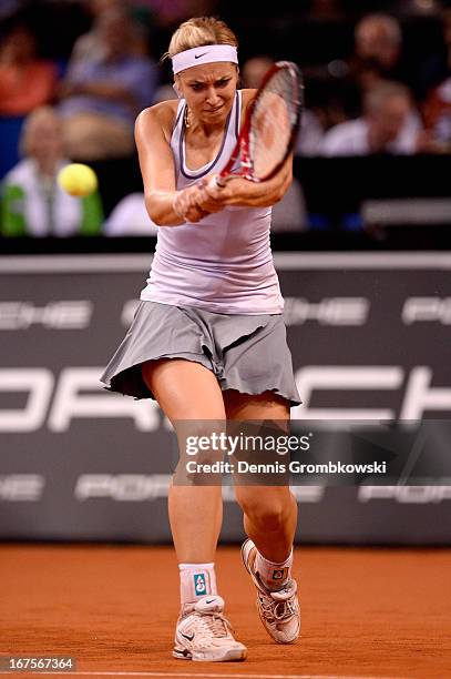 Sabine Lisicki of Germany plays a backhand in her match against Bethanie Mattek-Sands of the United States during Day 5 of the Porsche Tennis Grand...