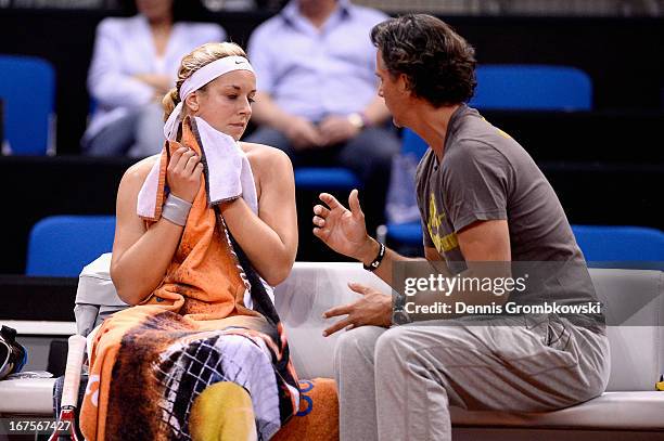 Coach Robert Orlik gives instructions to Sabine Lisicki of Germany during Day 5 of the Porsche Tennis Grand Prix at Porsche-Arena on April 26, 2013...