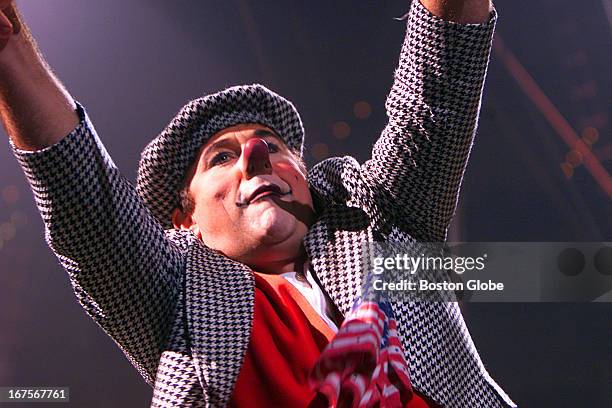 At the Ringling Bros. And Barnum & Bailey Circus at the Fleet Center, clown David Larible motions to the crowd during his rap music performance.