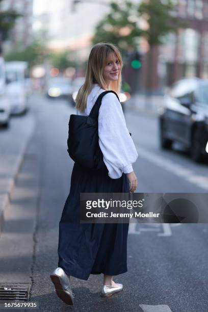 SoSue Rock und blouse, Zara ballerinas, VeeCollective bag on June 08, 2023 in Hamburg, Germany.