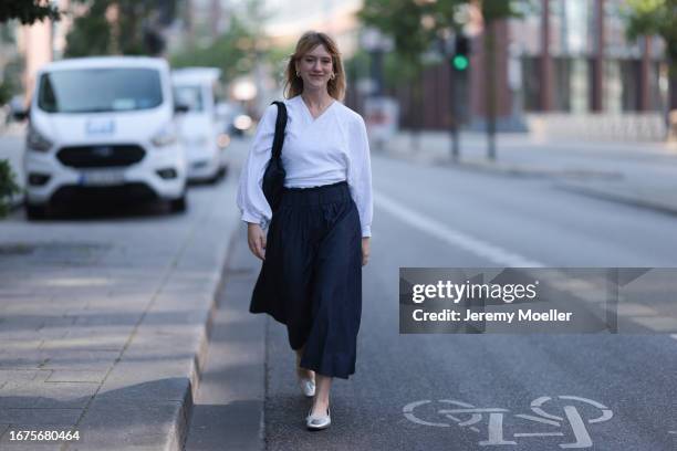 SoSue Rock und blouse, Zara ballerinas, VeeCollective bag on June 08, 2023 in Hamburg, Germany.