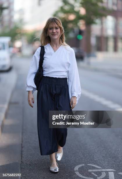 SoSue Rock und blouse, Zara ballerinas, VeeCollective bag on June 08, 2023 in Hamburg, Germany.