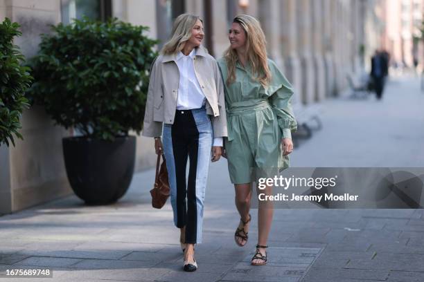 Josephine Kröger wearing mint colored knee length long sleeve SoSue dress and black open Celine sandal with straps and Sue Giers wearing Celine bag,...