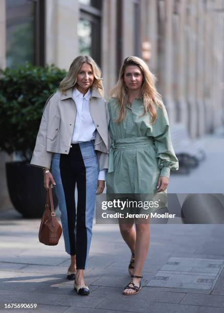 Josephine Kröger wearing mint colored knee length long sleeve SoSue dress and black open Celine sandal with straps and Sue Giers wearing Celine bag,...