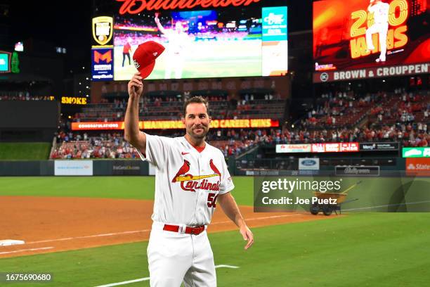 Adam Wainwright of the St. Louis Cardinals acknowledges fans after his 200th win in a game against the Milwaukee Brewers at Busch Stadium on...