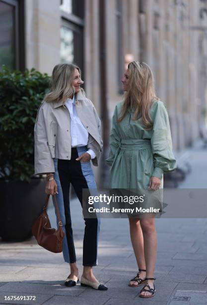 Josephine Kröger wearing mint colored knee length long sleeve SoSue dress and black open Celine sandal with straps and Sue Giers wearing Celine bag,...