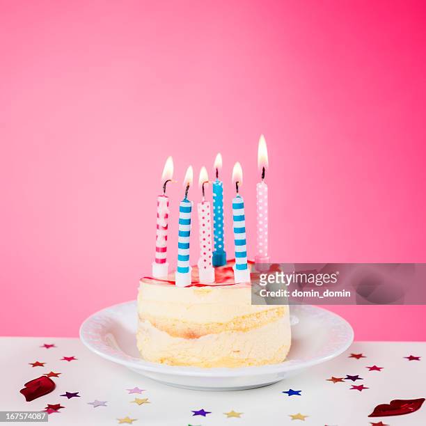 birthday cake with candles standing on the table, pink background - cake isolated stock pictures, royalty-free photos & images