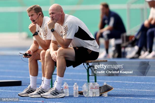 Svenn bender, assistant coach and Toma Trocha, goalkeeper coach of Germany sit on the benchduring the U17 4-Nations tournament between Germany and...