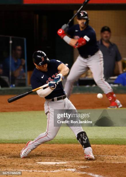 Rob Refsnyder of the Boston Red Sox hits a two-RBI single during the eighth inning against the Texas Rangers at Globe Life Field on September 18,...