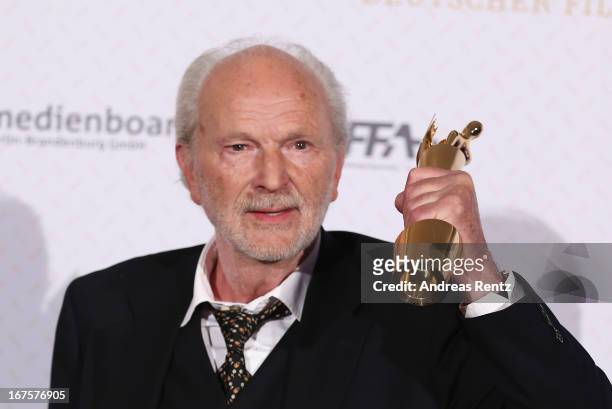 Michael Gwisdek poses with his award during the Lola - German Film Award 2013 at Friedrichstadt-Palast on April 26, 2013 in Berlin, Germany. Gwisdek...