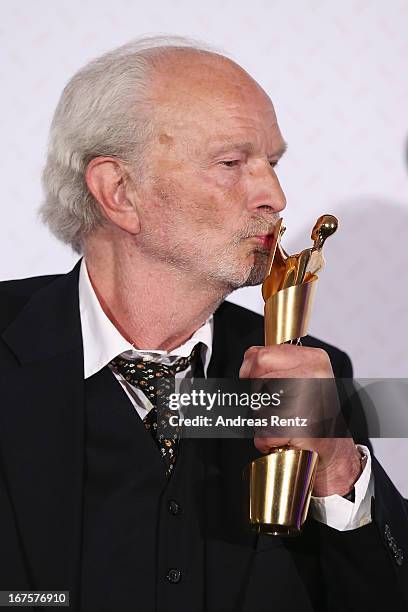 Michael Gwisdek poses with his award during the Lola - German Film Award 2013 at Friedrichstadt-Palast on April 26, 2013 in Berlin, Germany. Gwisdek...