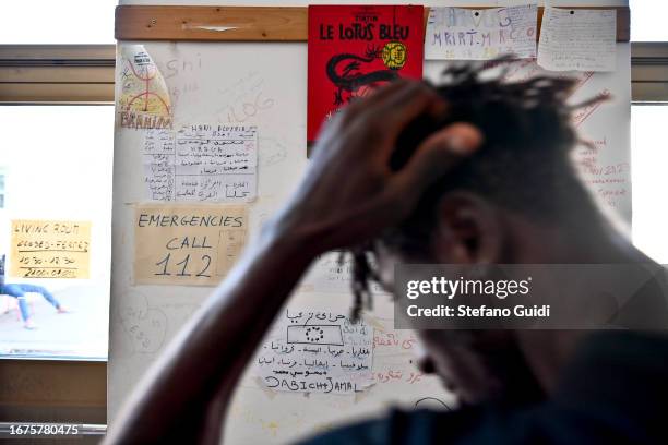 Migrants see the travel information inside the Rifugio Fraternità Massi on September 11, 2023 in Oulx, Italy. The Rifugio Fraternità Massi of Oulx,...