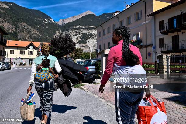 Migrants from Sudan and Guinea prepare to leave outside the Rifugio Fraternità Massi as they head to the bus station to go towards Claviere on...