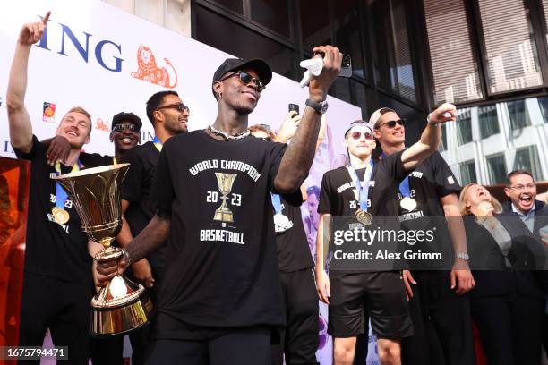 Dennis Schroeder and teammates celebrate on stage during a reception for the German National Basketball Team on September 12, 2023 in Frankfurt am...