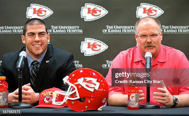 Kansas City Chiefs offensive tackle Eric Fisher, left, with Chiefs head coach Andy Reid, smiles during his introductory press conference with his new...