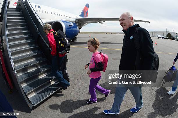 Head Coach, George Karl, of the Denver Nuggets walks to the airplane for the flight to Oakland prior to Game Three of the Western Conference...