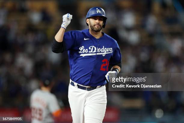 Designated hitter J.D. Martinez of the Los Angeles Dodgers celebrates after hitting a three-run home run against starting pitcher Eduardo Rodriguez...