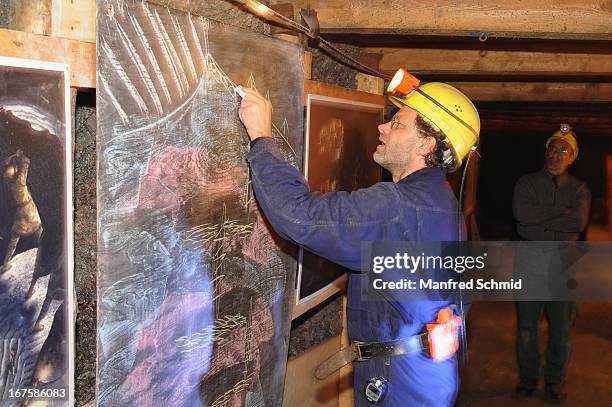 Hans Reschreiter speaks to the audience during a visit to the oldest known wooden staircase which leads to a salt mine on April 26, 2013 in...
