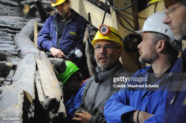 Michael Grabner speaks to the audience during beside the oldest known wooden staircase which leads to a salt mine on April 26, 2013 in Hallstatt,...
