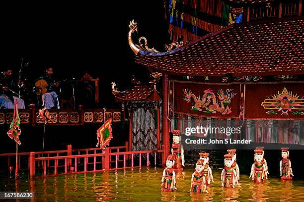 Vietnamese water puppets at the puppet show in Hanoi. Though water puppet shows were originally amusement for rice farmers, using rice paddies for...