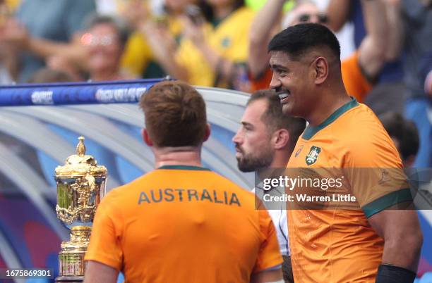 Will Skelton of Australia leads his team out onto the pitch passing the Webb Ellis trophy of the Rugby World Cup France 2023 match between Australia...