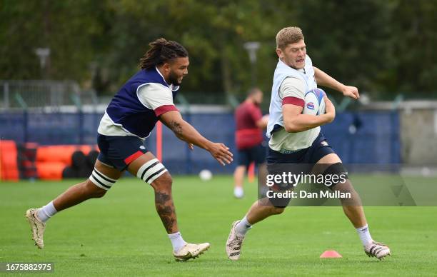 Jack Willis of England makes a break past Lewis Ludlam of England during a training session at Stade Ferdinand Petit on September 12, 2023 in Le...