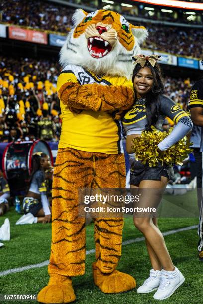 The Grambling State Tigers mascot entertains the crowd during the LSU Tigers cheerleaders entertain the crowd during a game between the LSU Tigers...