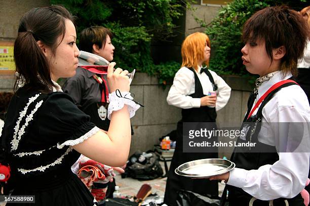 Taking a wine break after a long day of dressing up. "Cosplay" or costume play is a recent phenomenon in Japan. It is said that it began with the...