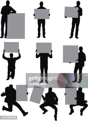 Man standing with placards Man standing with placards