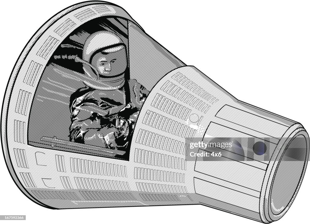 Astronaut in space capsule