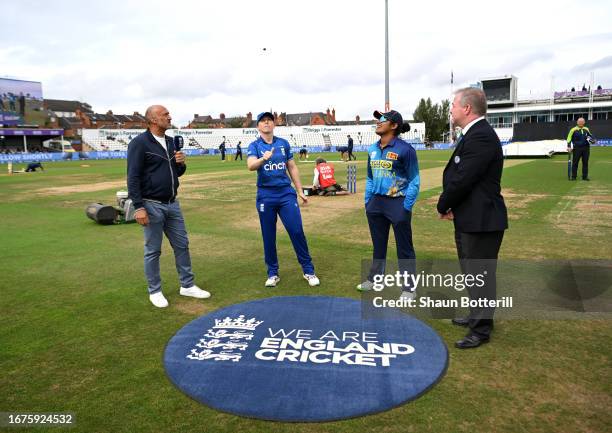 England Women's captain Heather Knight tosses the coin as Sri Lanka Women's captain Chamari Athapaththu looks on before the 2nd Metro Bank ODI...