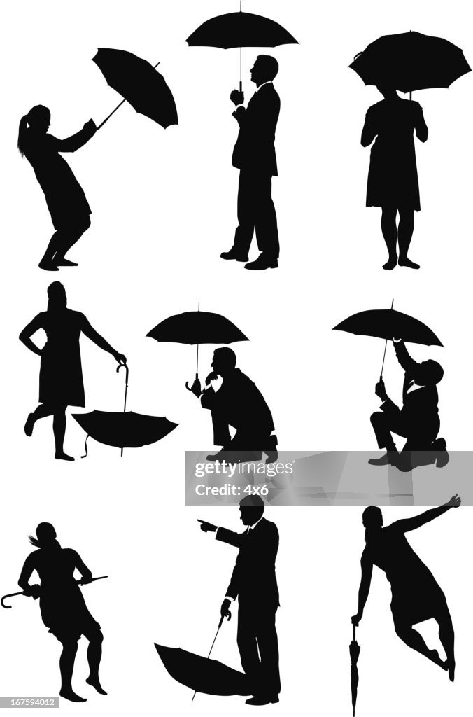 Business executives with umbrellas