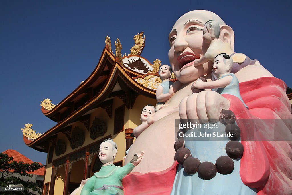 Buddha having his navel and ears cleaned by acolytes at...