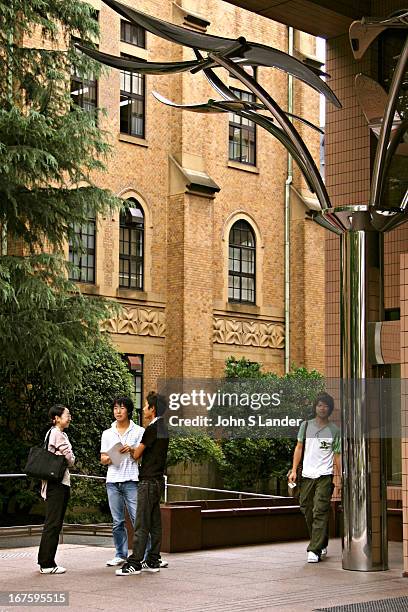 Students outside the main library of Keio University, Japan's oldest university, founded by Yukichi Fukuzawa - the man on the 10,000 Yen banknote....