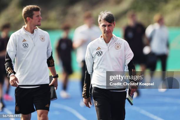 Sven Bender, assistant coach and head coach Michael Prus of Germany look on during the U17 4-Nations tournament between Germany and Italy at...