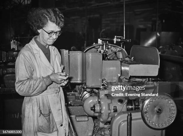 Mechanic and machinery at the Douglas company in Bristol where Vespa scooters are being manufactured, November 21st 1958.