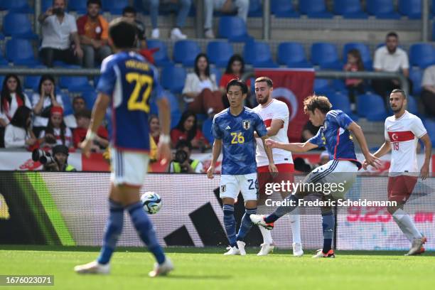 Atsuki Ito of Japan scores his teams first goal during the international friendly between Japan and Turkey at Cegeka Arena on September 12, 2023 in...