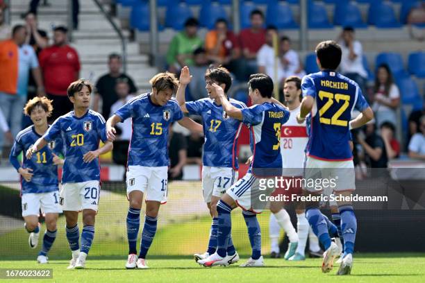 Atsuki Ito of Japan celebrates his teams first goal during the international friendly between Japan and Turkey at Cegeka Arena on September 12, 2023...