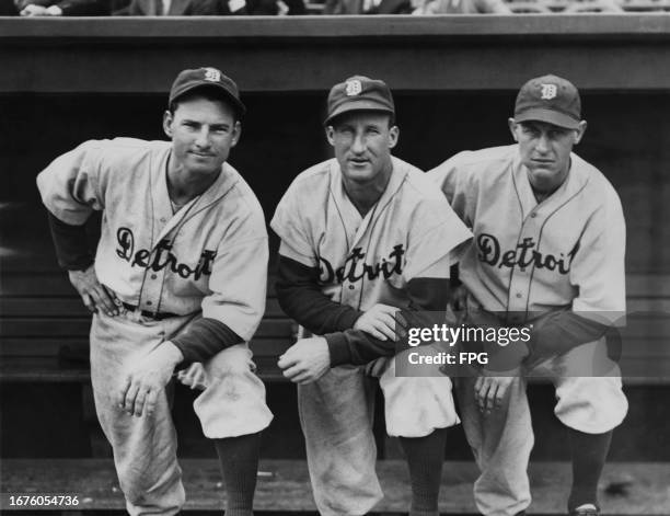 Hub Walker , Centerfielder, Goose Goslin , Left fielder and Jo-Jo White Outfielder for the Detroit Tigers pose for a photograph from the team dugout...