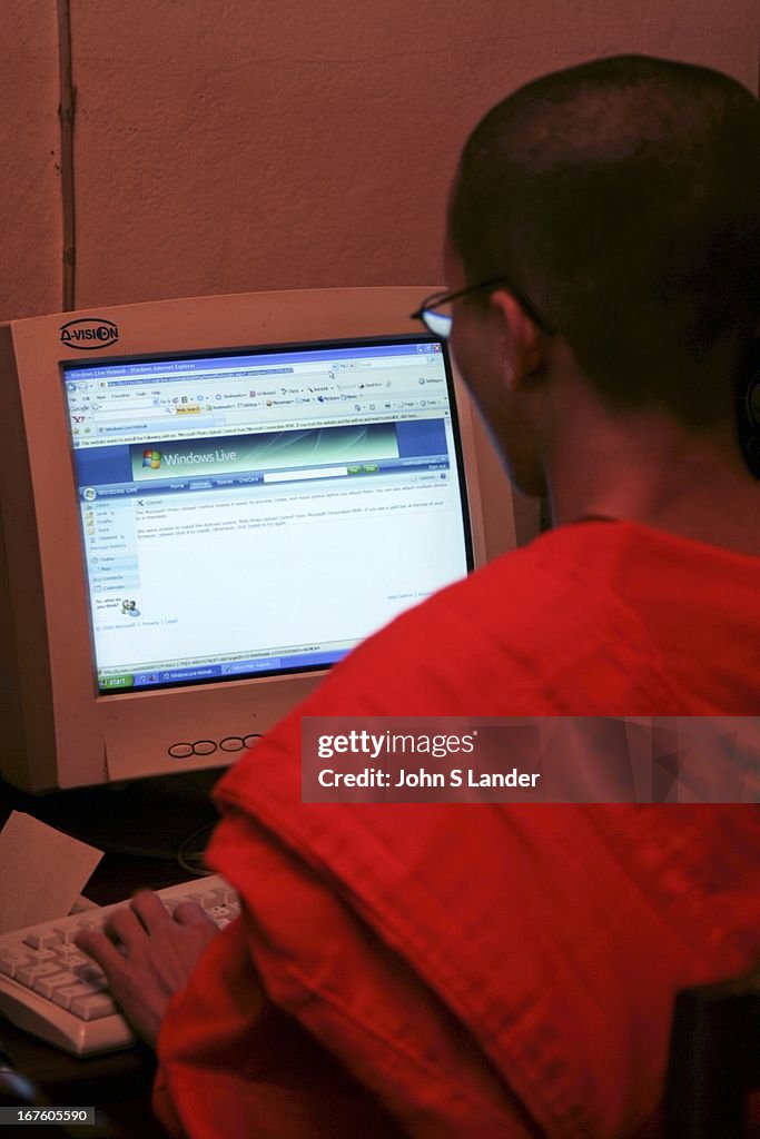 Monk logging on - Buddhism is the primary religion of Laos.