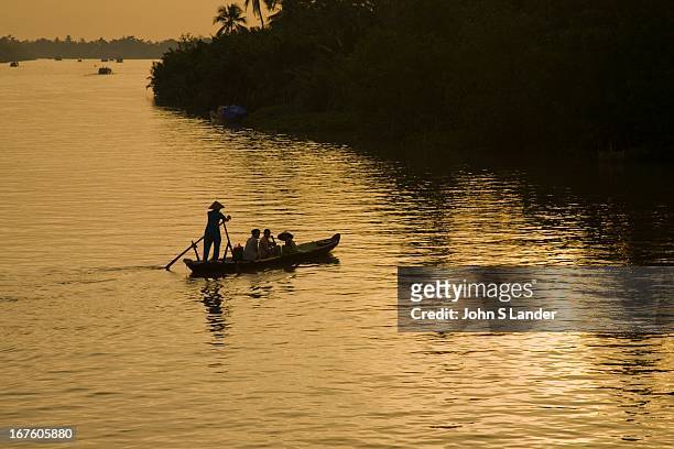 Mekong River at sunset - The Mekong River is the world's 10th longest river running for over 4,000 kilometers from the Tibetan Plateau through...