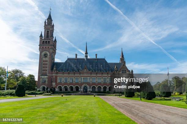 the peace palace in the hague, netherlands. - peace palace stock pictures, royalty-free photos & images