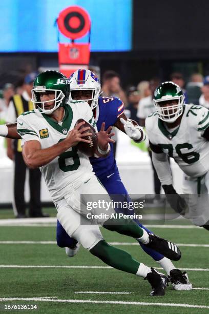 Quarterback Aaron Rodgers of the New York Jets is sacked by Leonard Floyd of the Buffalo Bills and suffers an apparent Achilles injury in the game at...
