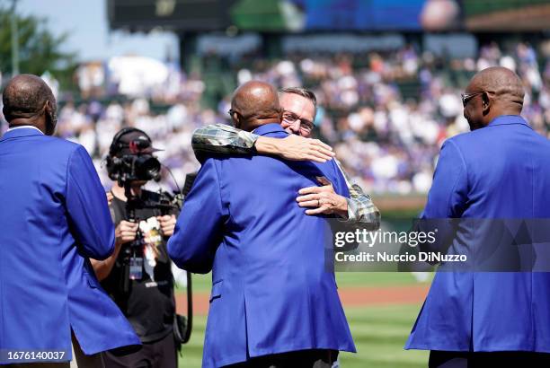 Mark Grace hugs Fergie Jenkins during a ceremony where he and and Shawon Dunston, joined other members of the Chicago Cubs Baseball Hall of Fame...