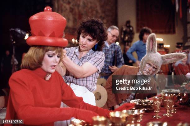 Actress Ann Jillian dressed as the Red Queen and Actor Red Buttons as the White Rabbit prior to filming the next scene of Alice In Wonderland movie...