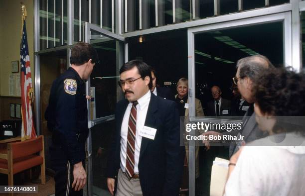 Representative from U.S. Federal Deposit Insurance Corporation enter at the now insolvent Golden Valley Bank, March 22, 1985 in Turlock, California.