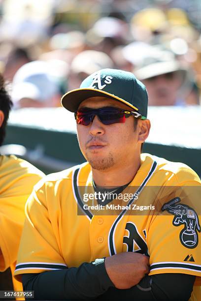 Hiroyuki Nakajima of the Oakland Athletics stands in the dugout during the game against the Detroit Tigers at O.co Coliseum on April 14, 2013 in...