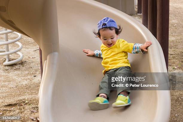 sliding down - peter parks stock pictures, royalty-free photos & images